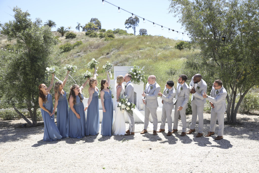 wedding party with dusty blue bridesmaids dresses